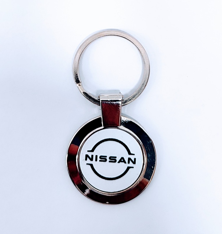 Брелок Nissan, білий круглий металевий (41526)